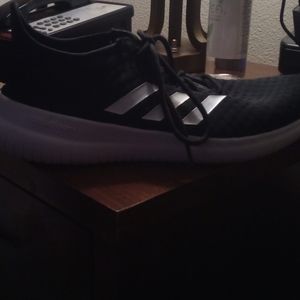 A pair of Adidas shoes.